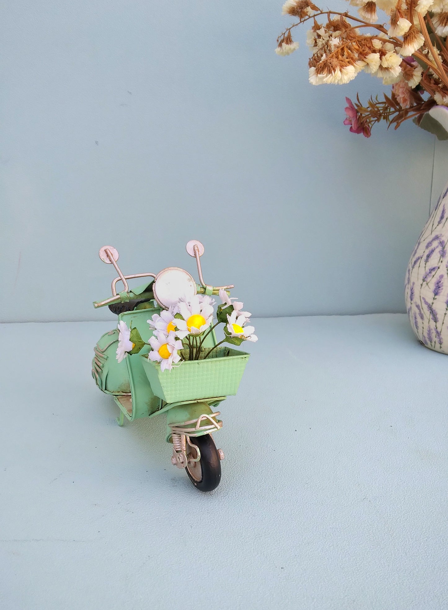 Green Vespa Scooter With Flower Basket