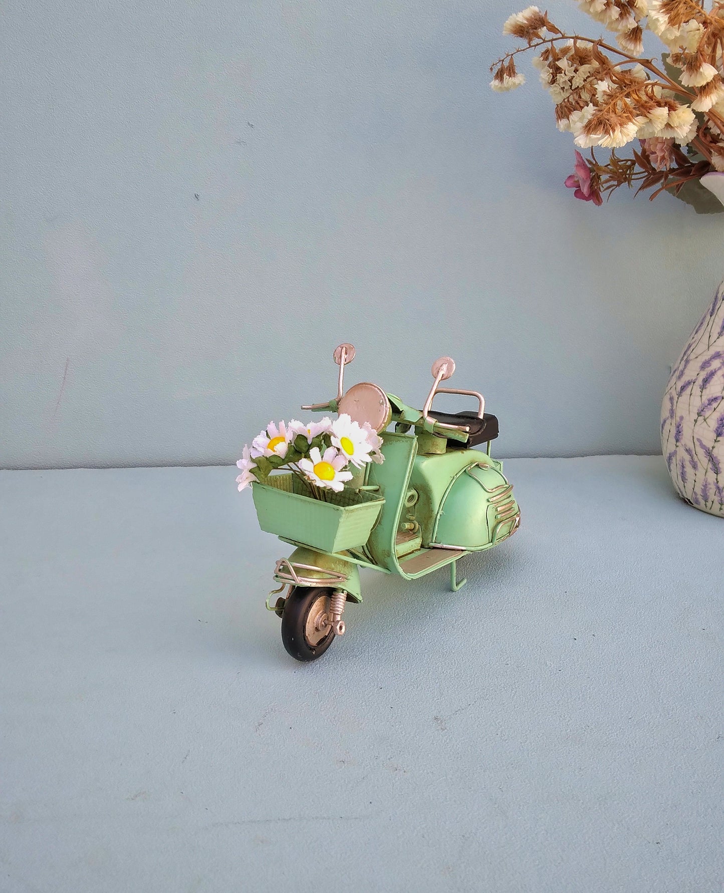 Green Vespa Scooter With Flower Basket