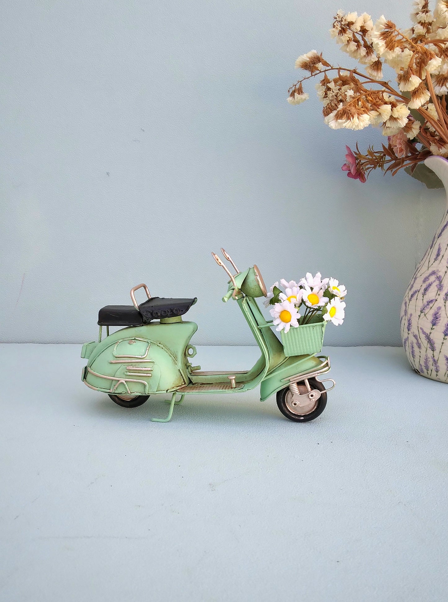 Green Vespa Scooter With Flower Basket