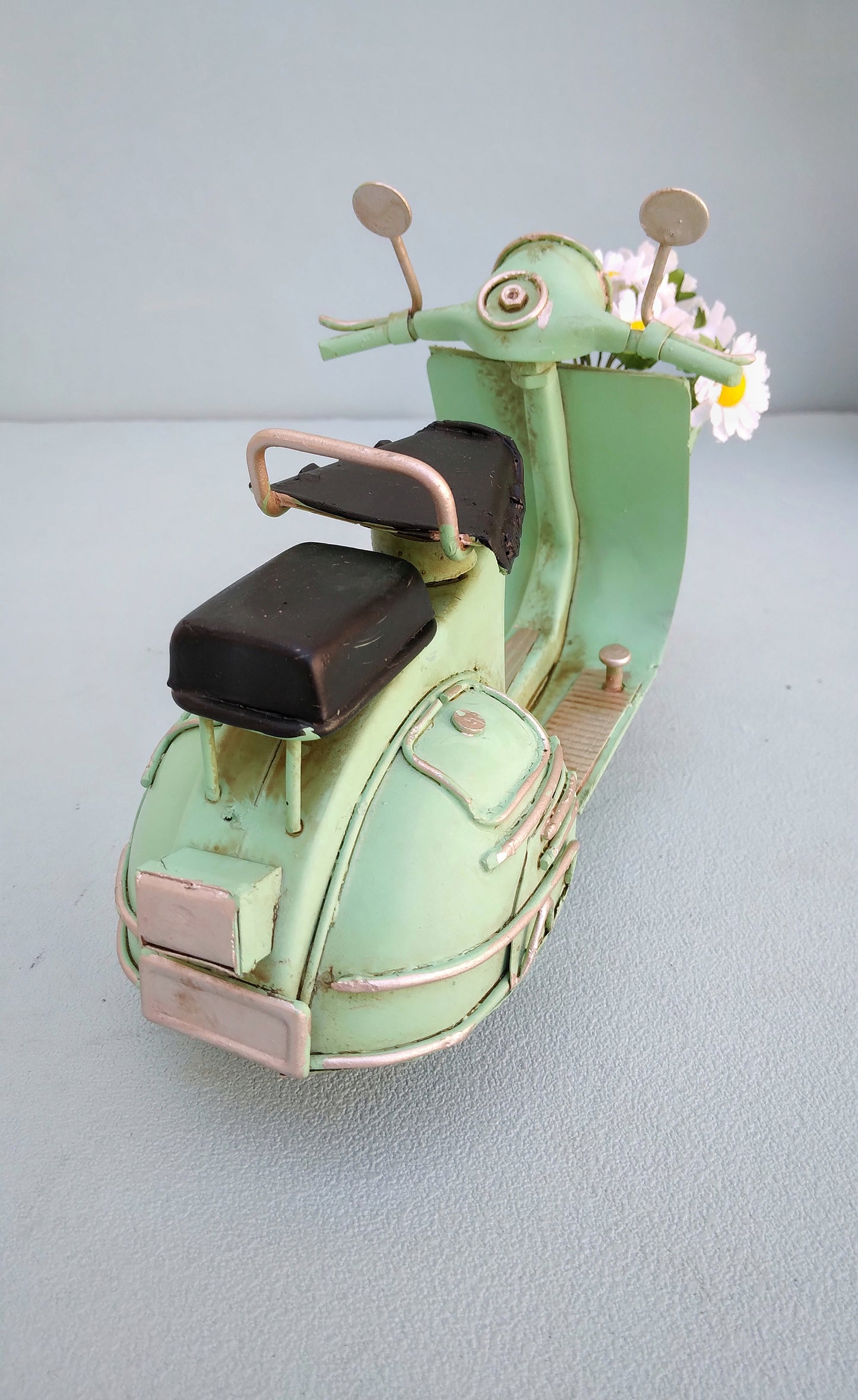 Green Vespa Scooter With Flower Basket