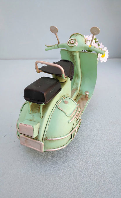 Green Vespa Scooter With Flower Basket